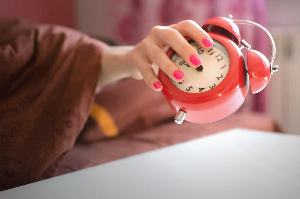Woman+throwing+alarm+clock+away